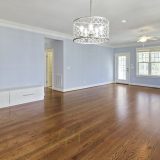 Empty Room with Blue Walls and Silver Chandelier