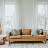 White and Brown Sofa Chair Near White Window Curtain