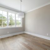 Empty Room with a Window and a Parquet Floor